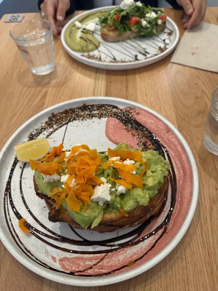 Avo smash on beetroot hummus