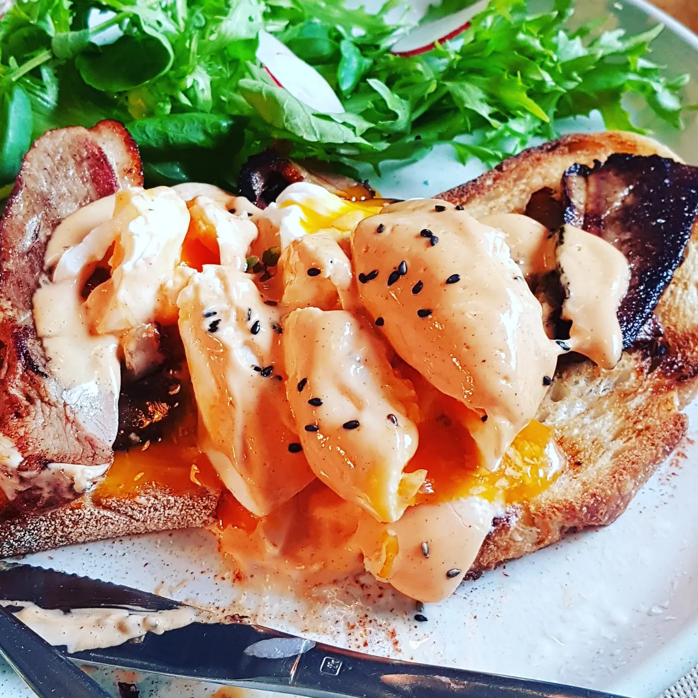 Mortadella benedict with hollandaise and black sesame